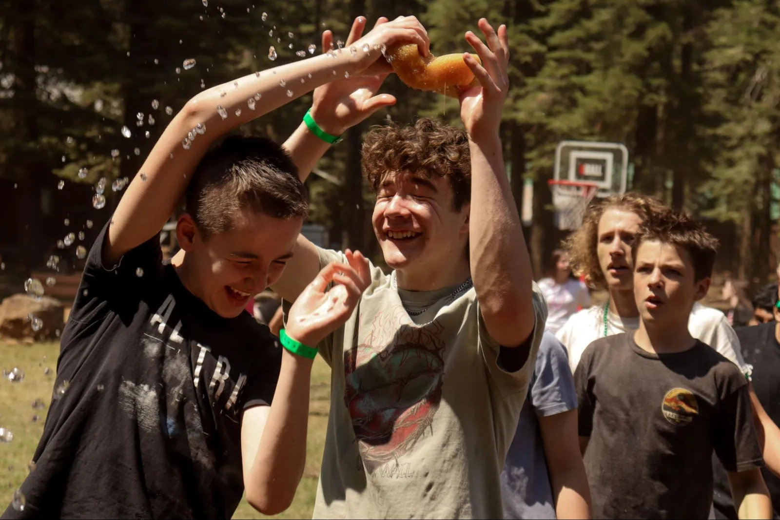 CVA Youth students laughing during an outdoor water game