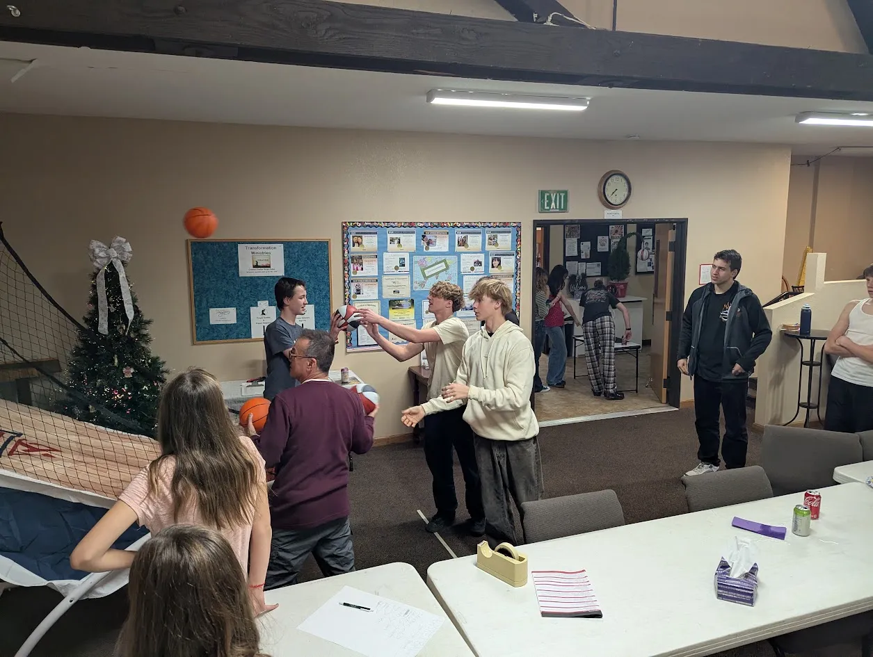 Students playing a game together in the church fellowship hall